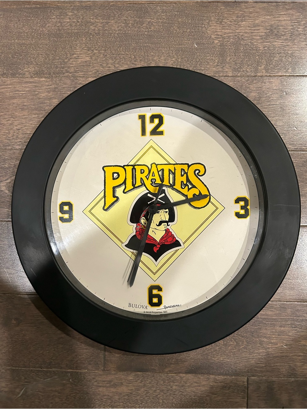 Bulova Pirates Wall Clock - Black and Yellow with Red Accent